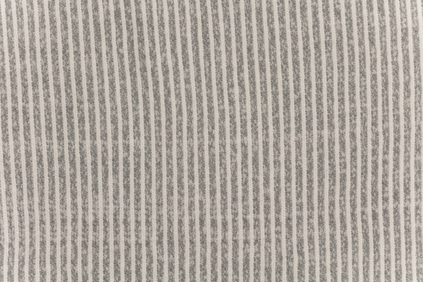 A fabric swatch of a knit baby swaddle.